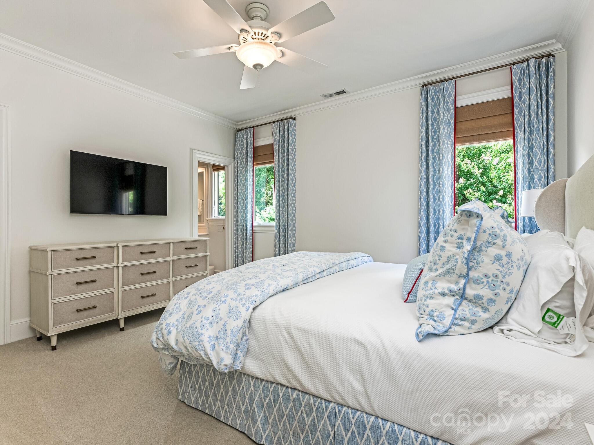 330 South Canterbury Road Charlotte, NC 28211 - Photo 31 of 41 a bedroom with a bed and a flat screen tv