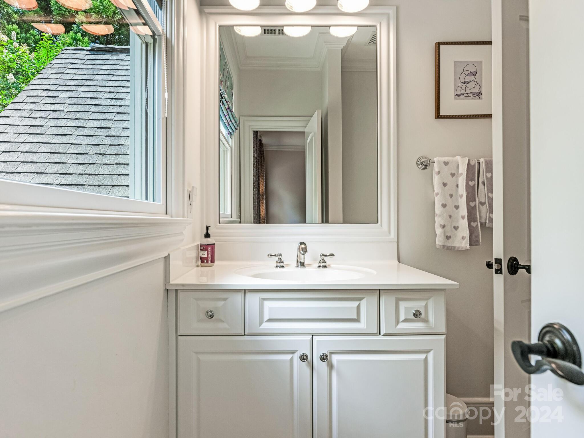 330 South Canterbury Road Charlotte, NC 28211 - Photo 34 of 41 a bathroom with a sink and a mirror