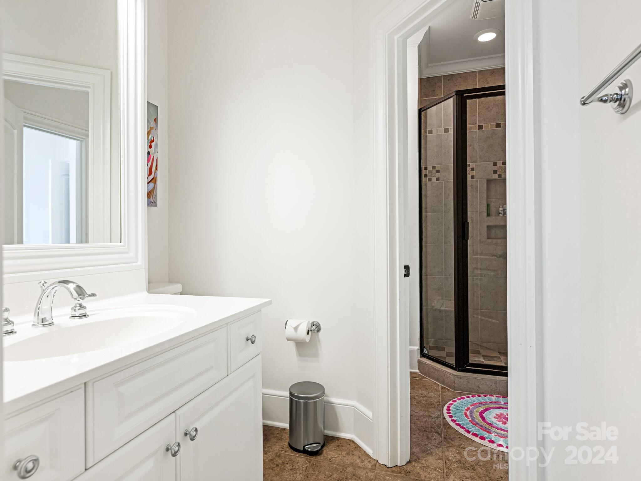 330 South Canterbury Road Charlotte, NC 28211 - Photo 36 of 41 a bathroom with a sink and a mirror