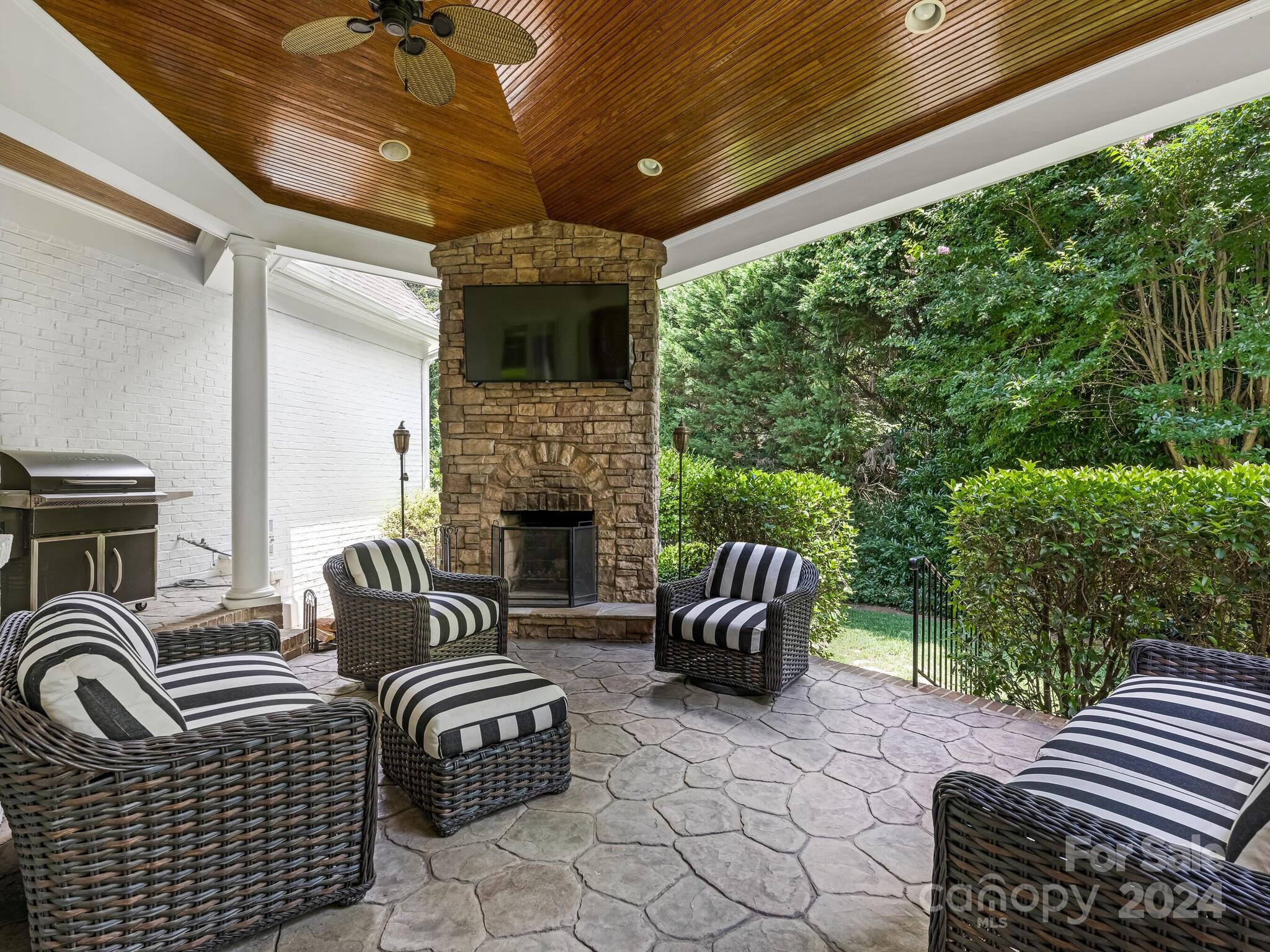 330 South Canterbury Road Charlotte, NC 28211 - Photo 37 of 41 a outdoor living space with furniture and a fireplace