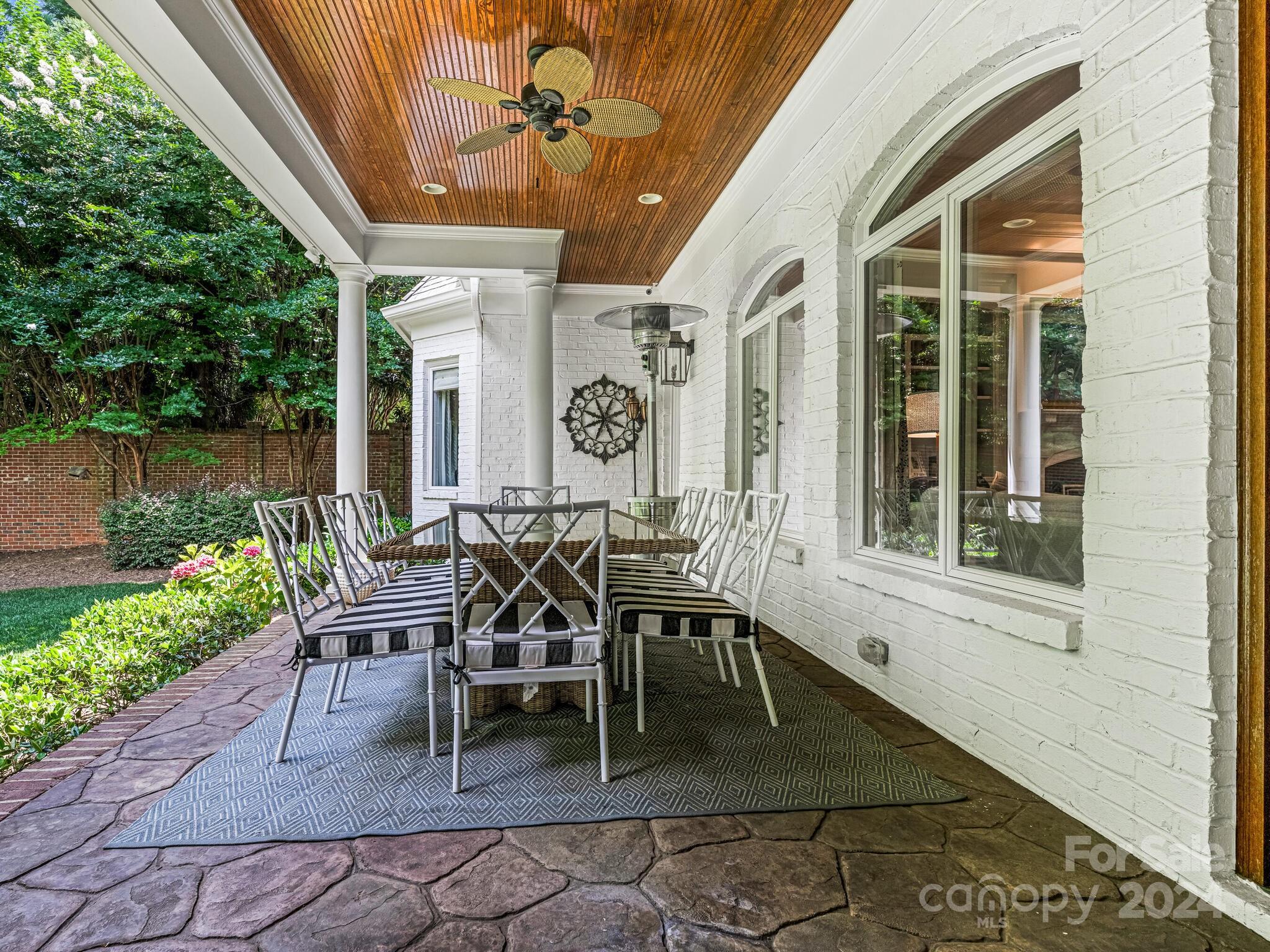 330 South Canterbury Road Charlotte, NC 28211 - Photo 38 of 41 a view of a dinning tables and chairs in patio of a house