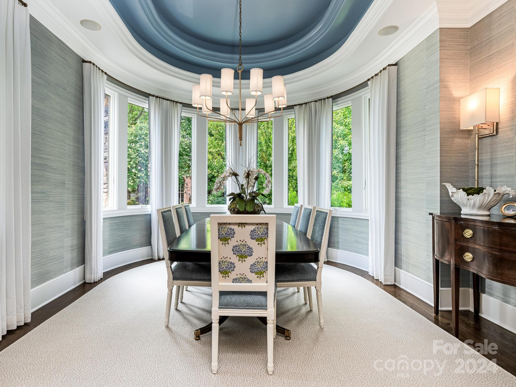 330 South Canterbury Road Charlotte, NC 28211 - Photo 4 of 41 a dining room with furniture a chandelier and wooden floor