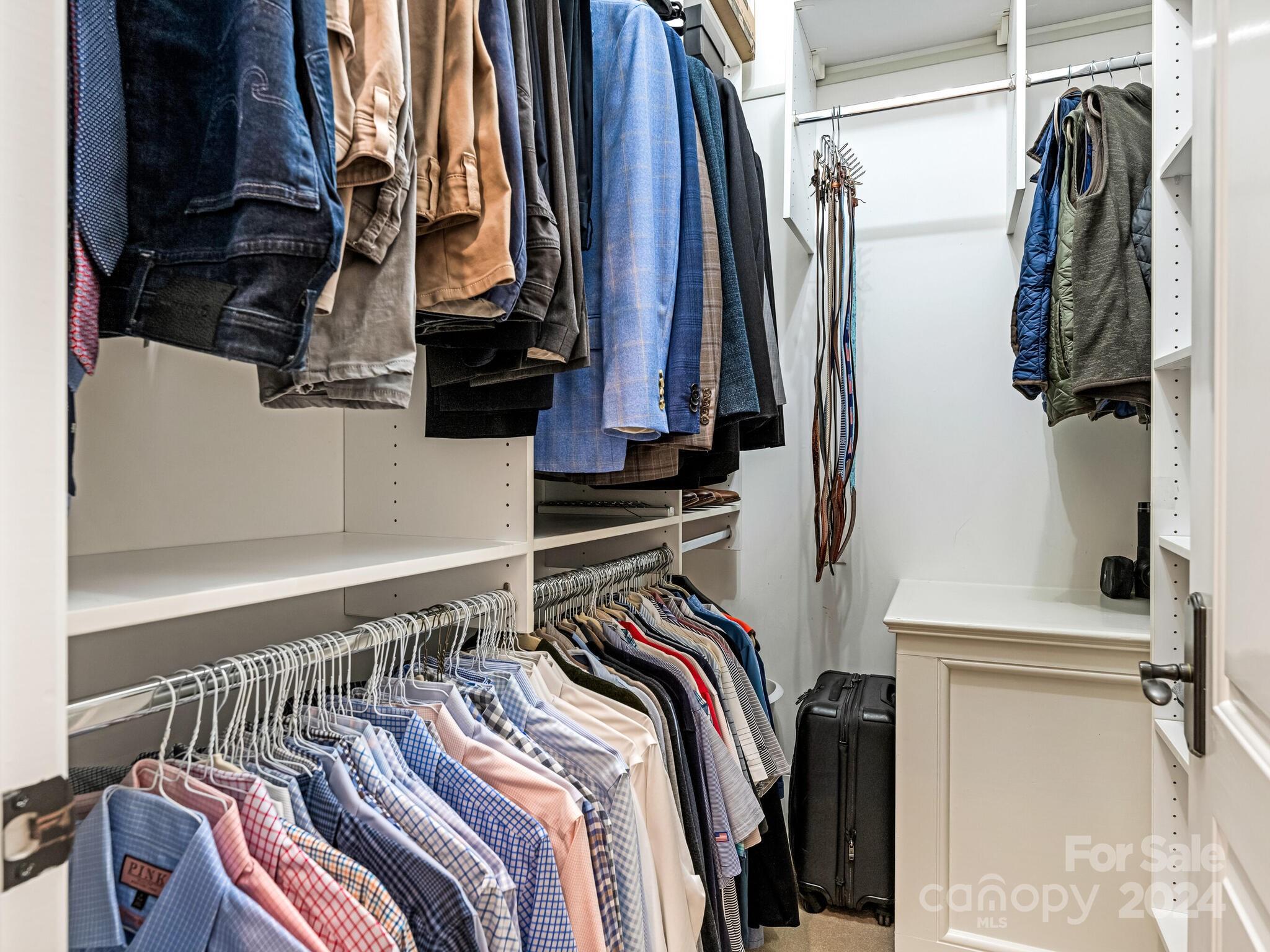 330 South Canterbury Road Charlotte, NC 28211 - Photo 10 of 41 a view of walk in closet with clothes and shoes