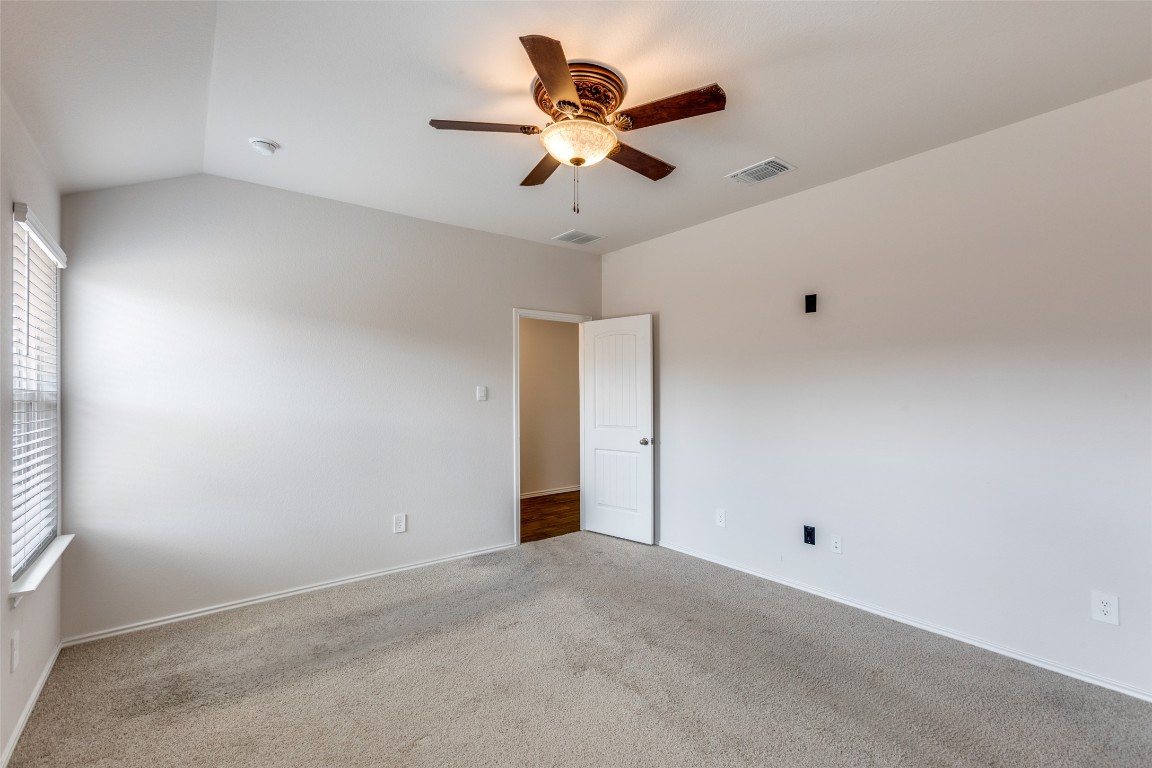 408 Frogmore Loop Kyle, TX 78640 - Photo 13 of 25 an empty room with ceiling fan and window