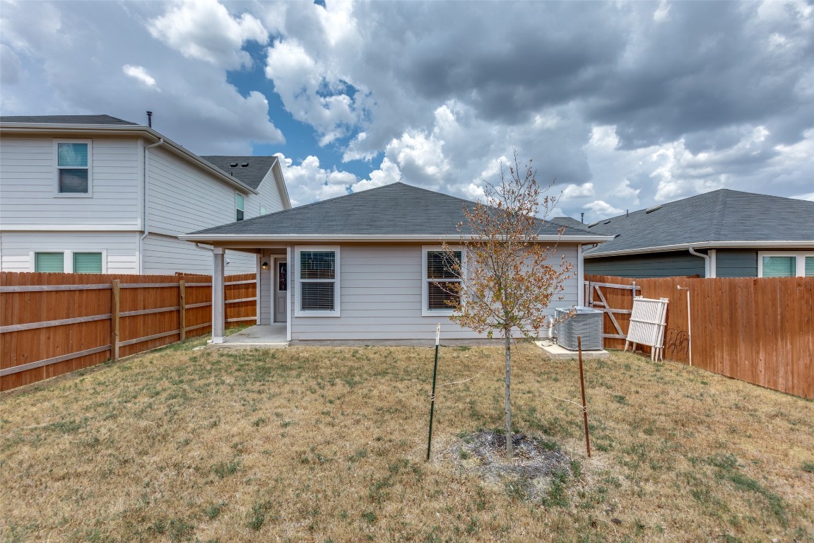 408 Frogmore Loop Kyle, TX 78640 - Photo 22 of 25 a backyard of a house with table and chairs
