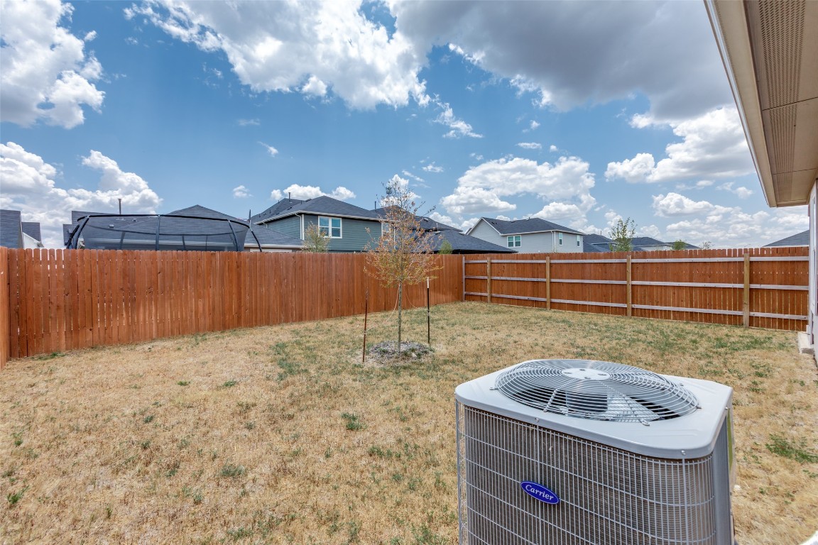 408 Frogmore Loop Kyle, TX 78640 - Photo 24 of 25 a backyard of a house with lots of green space