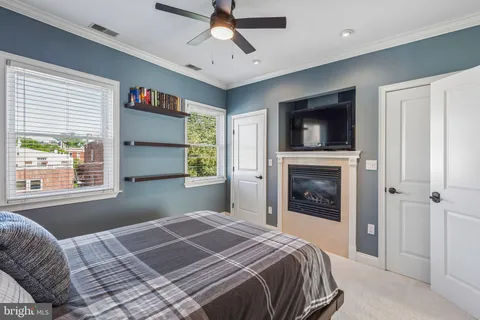 a spacious bedroom with a large bed and a flat screen tv