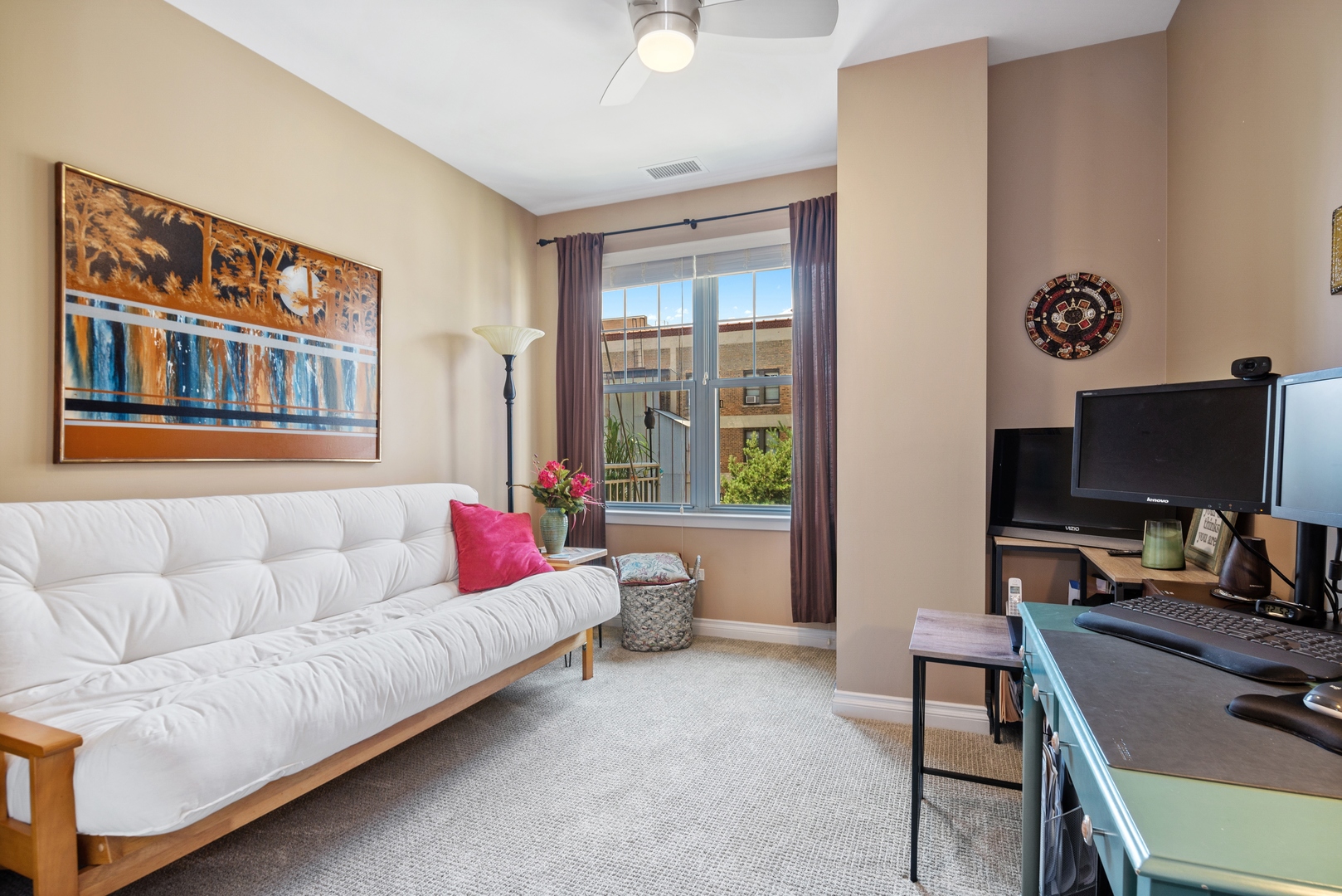 5556 North Sheridan Road, Unit 408 Chicago, IL 60640 - Photo 16 of 19 a living room with furniture and a flat screen tv