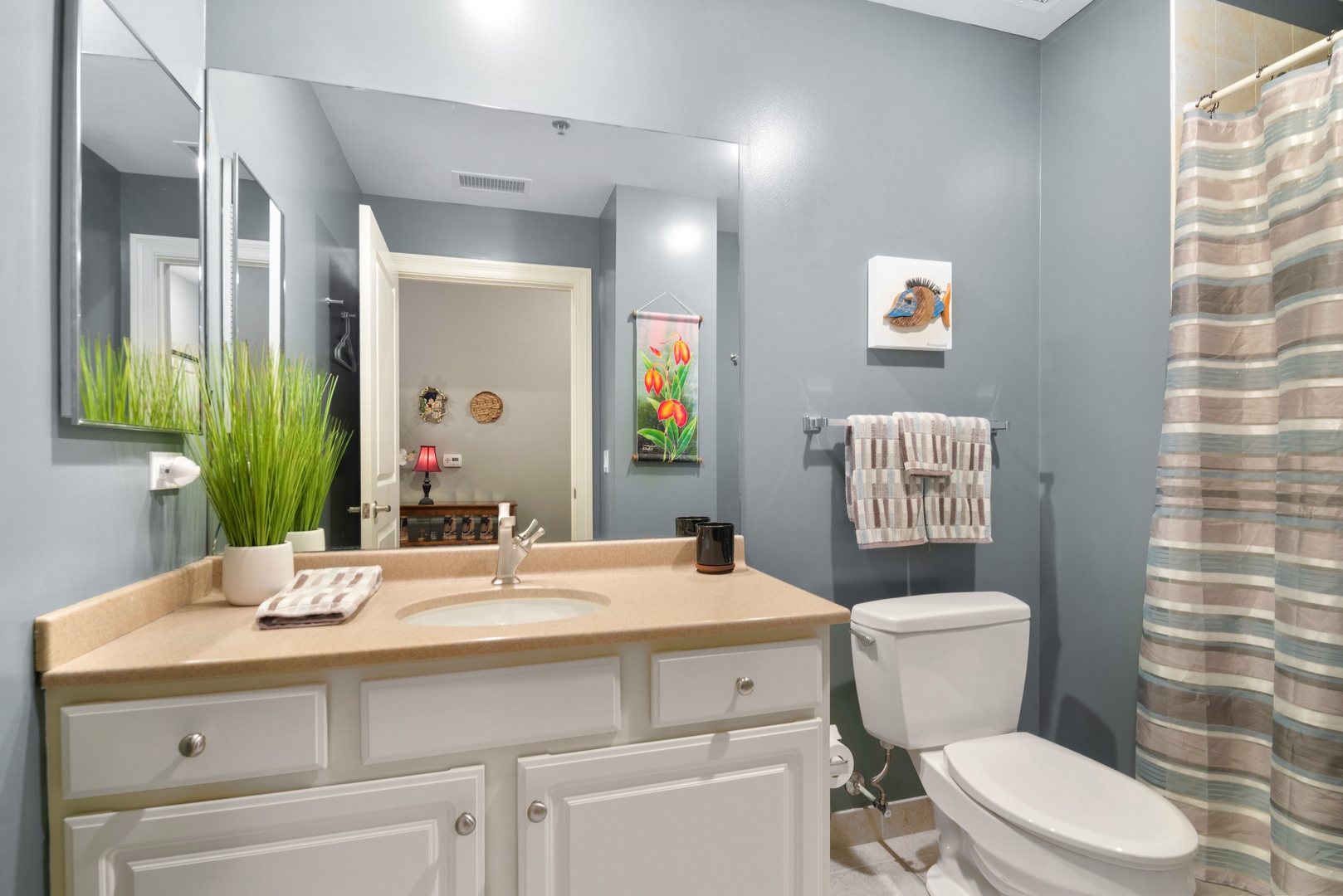 5556 North Sheridan Road, Unit 408 Chicago, IL 60640 - Photo 17 of 19 a bathroom with a sink toilet and mirror