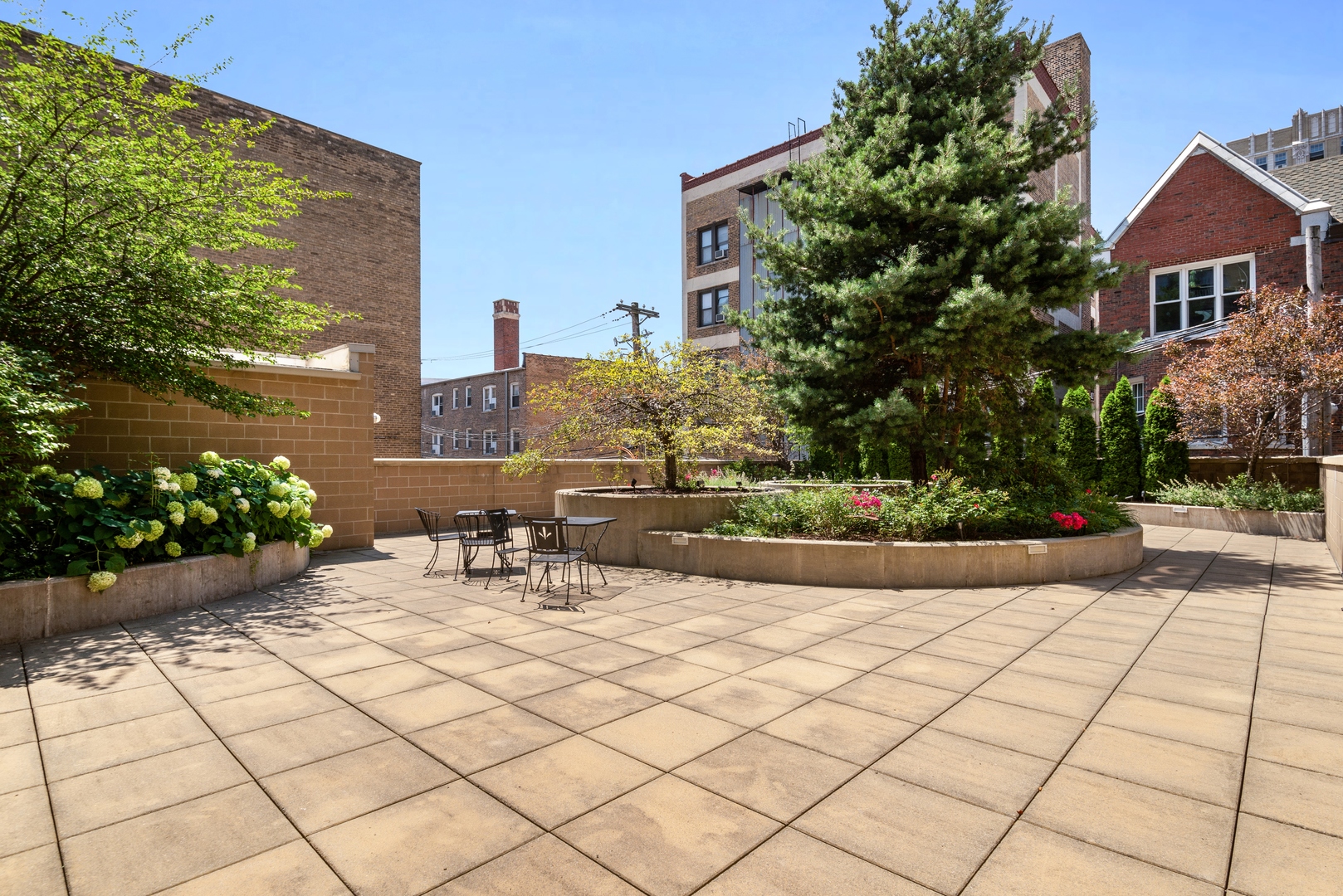 5556 North Sheridan Road, Unit 408 Chicago, IL 60640 - Photo 19 of 19 a view of a chairs and tables in the patio