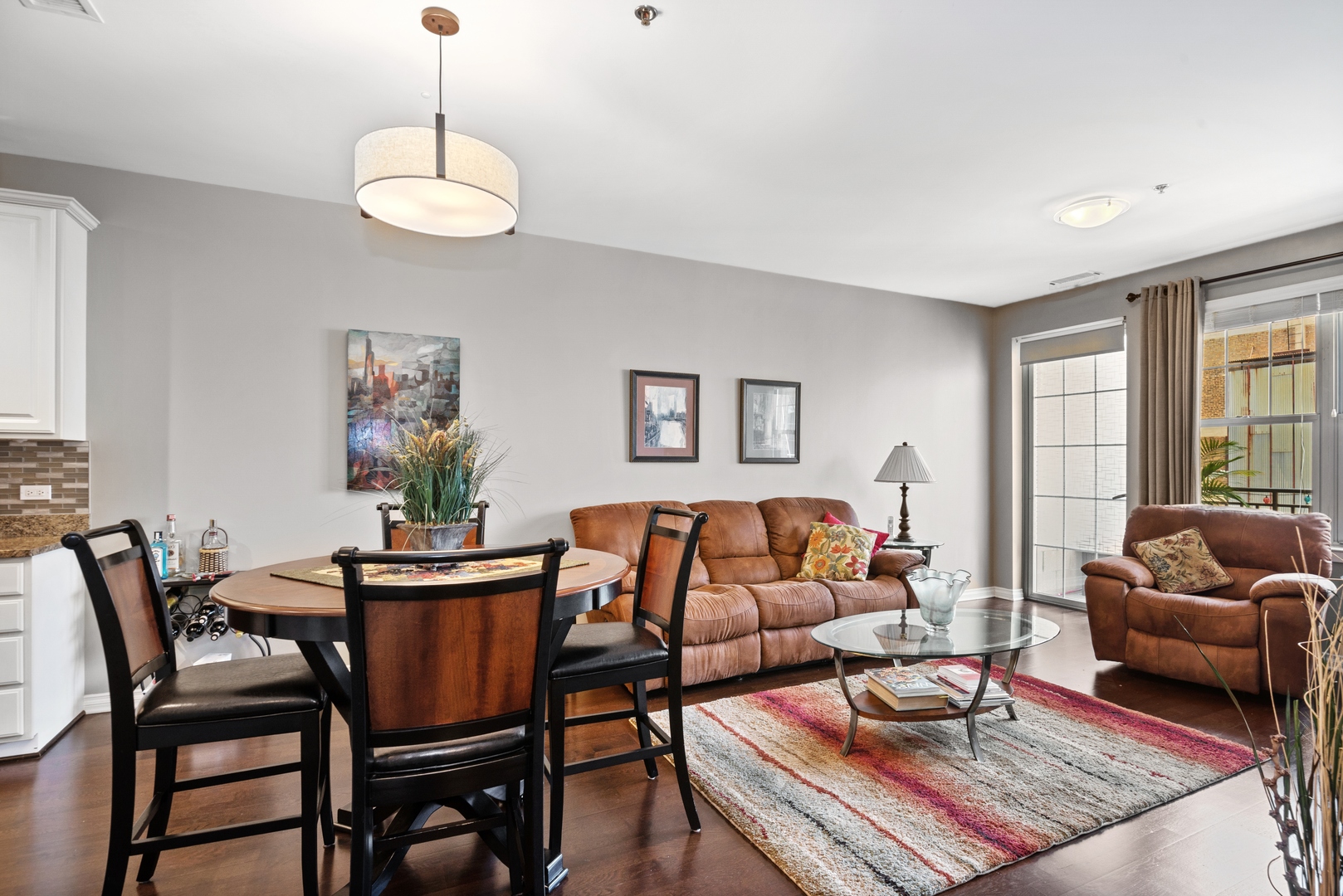 5556 North Sheridan Road, Unit 408 Chicago, IL 60640 - Photo 7 of 19 a living room with furniture and a large window
