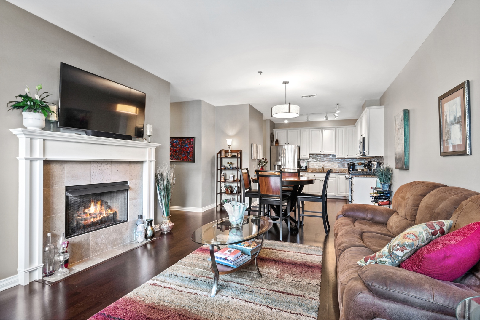 5556 North Sheridan Road, Unit 408 Chicago, IL 60640 - Photo 8 of 19 a living room with furniture and a fireplace