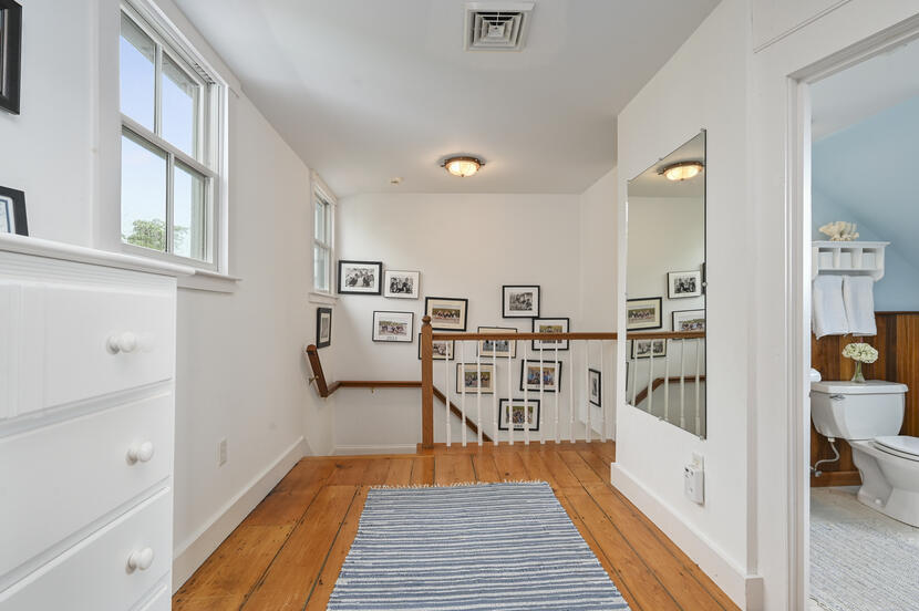 69 Doane Road Harwich Port, MA 02646 - Photo 17 of 38 a view of a kitchen with furniture and wooden floor