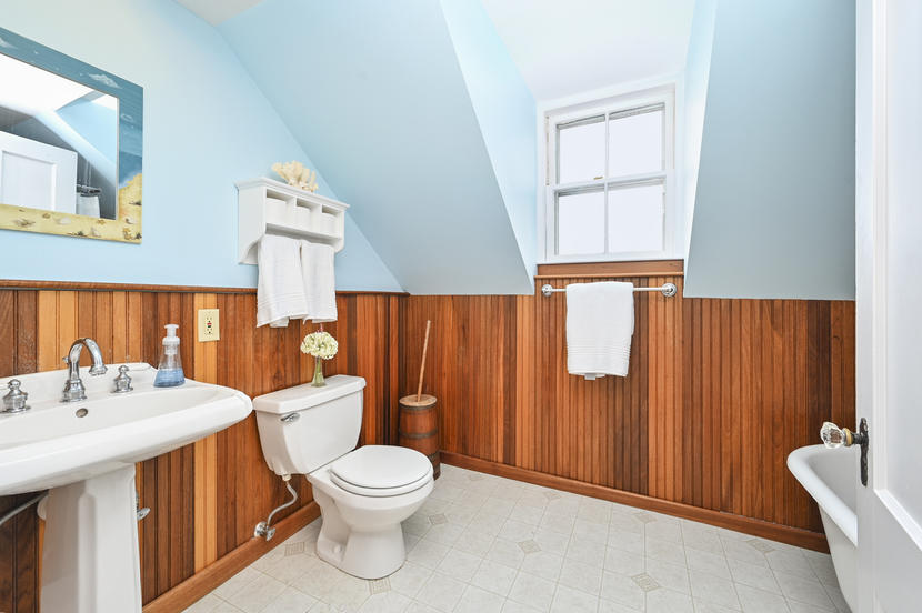 69 Doane Road Harwich Port, MA 02646 - Photo 22 of 38 a white toilet sitting next to a bathroom sink