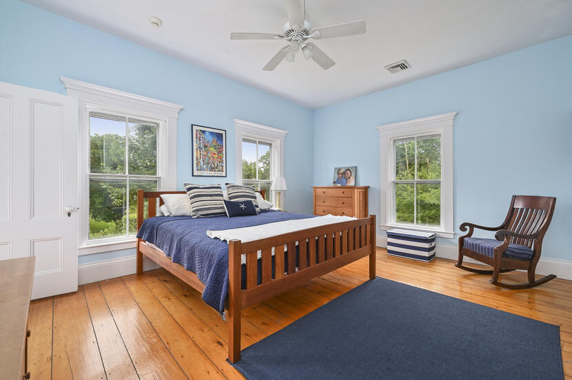 69 Doane Road Harwich Port, MA 02646 - Photo 23 of 38 a bedroom with a bed and wooden floor