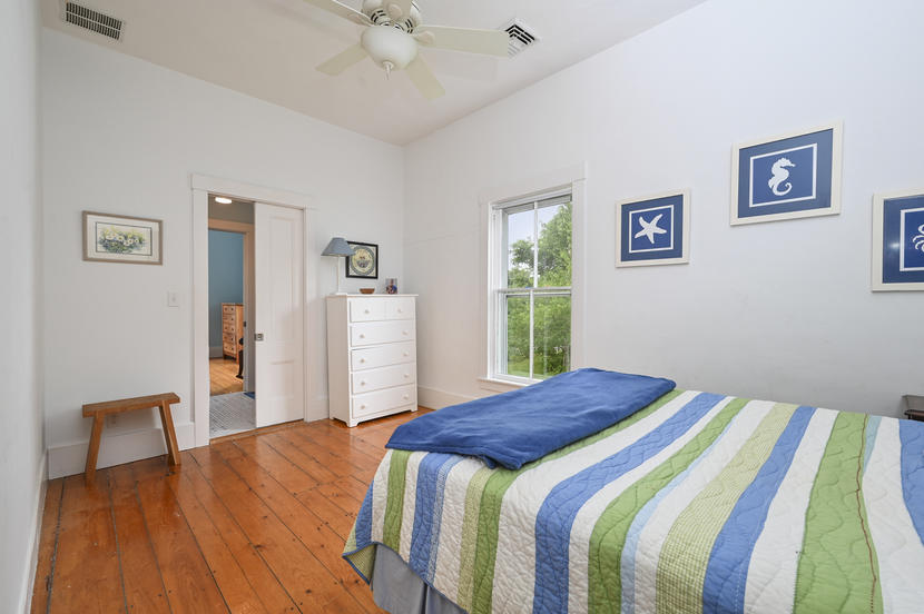 69 Doane Road Harwich Port, MA 02646 - Photo 25 of 38 a bedroom with a bed and a dresser
