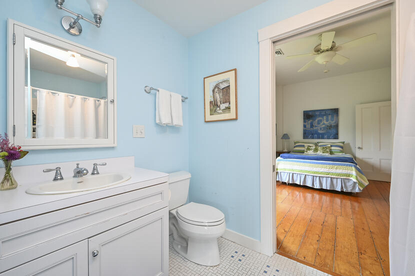 69 Doane Road Harwich Port, MA 02646 - Photo 26 of 38 a bathroom with a sink a toilet and mirror