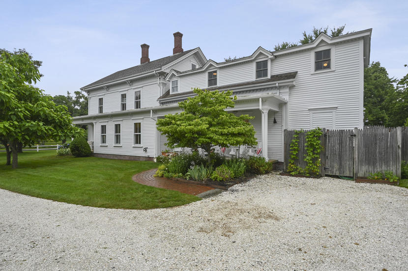 69 Doane Road Harwich Port, MA 02646 - Photo 27 of 38 a front view of a house with a yard and garage