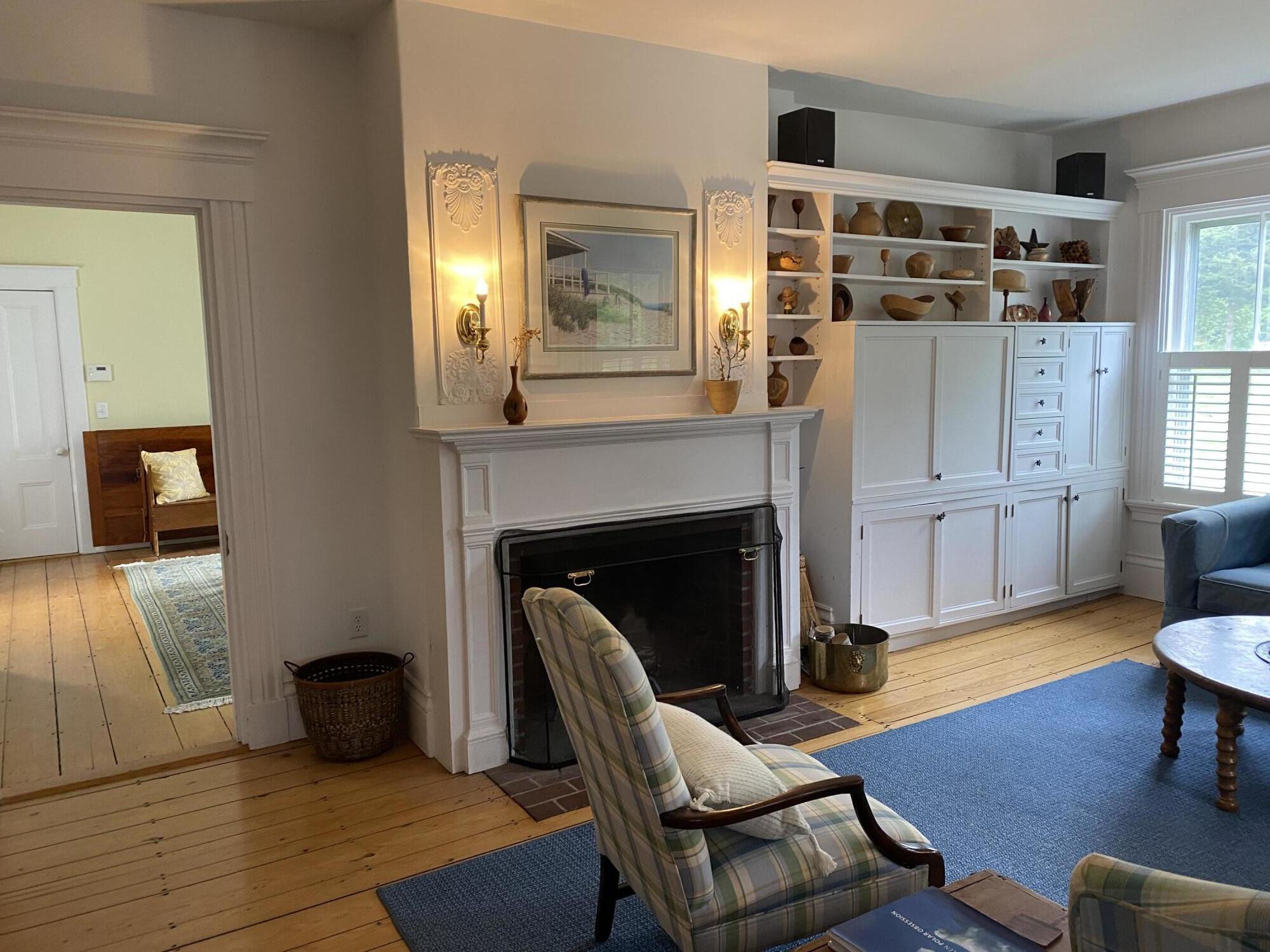 69 Doane Road Harwich Port, MA 02646 - Photo 3 of 38 a living room with furniture and a fireplace