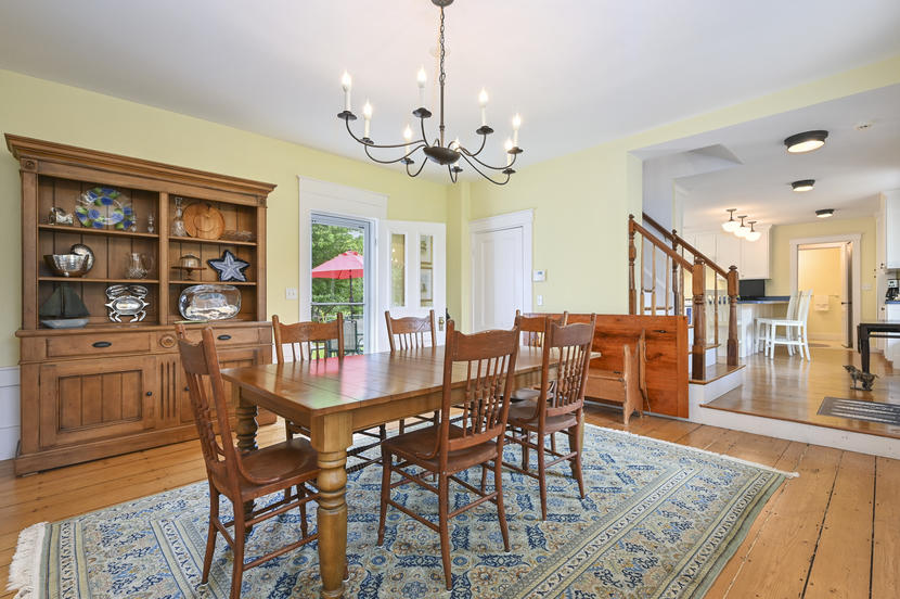 69 Doane Road Harwich Port, MA 02646 - Photo 6 of 38 a view of a dining room with furniture wooden floor and chandelier