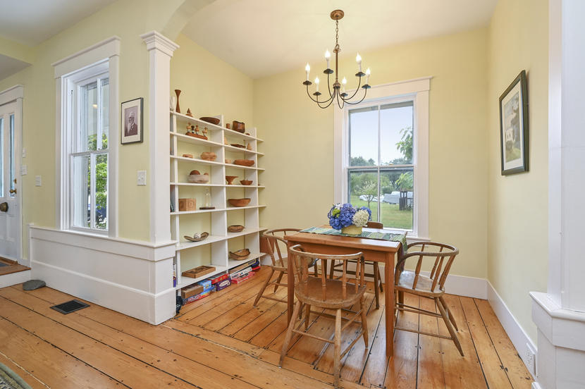 69 Doane Road Harwich Port, MA 02646 - Photo 7 of 38 a dining room with furniture a chandelier and wooden floor