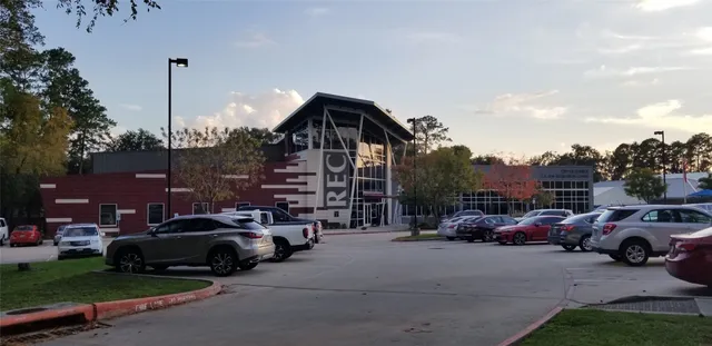 a view of cars parked in front of a house