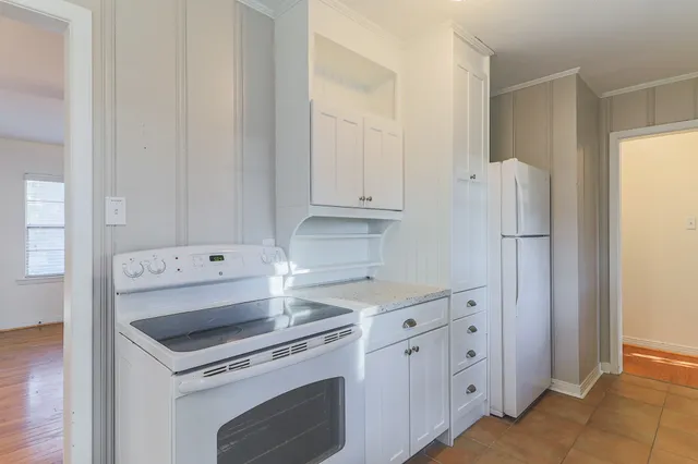 a kitchen with cabinets and appliances