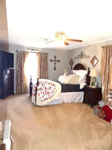 a white toilet sitting next to a shower curtain