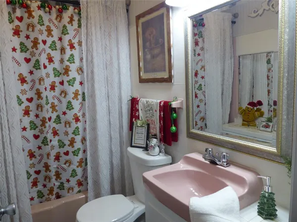 a bathroom with a sink vanity and a mirror