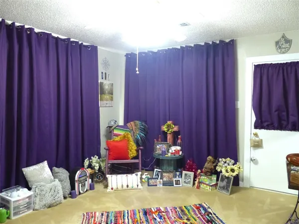 a living room with hard wood flooring and a couch