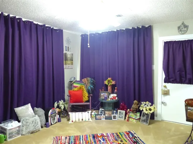 a living room with hard wood flooring and a couch