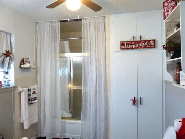 a room with a sink cabinets and wooden floor