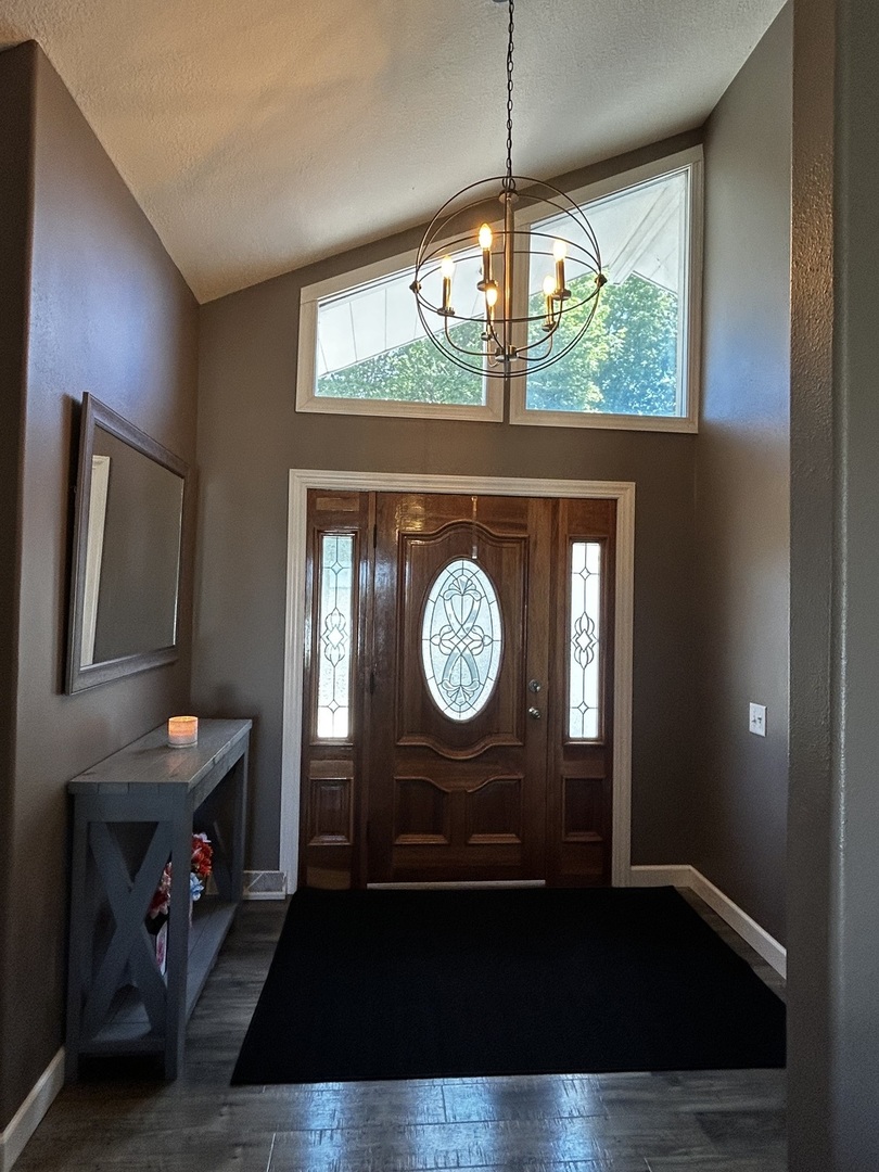 12795 Lawrence Road Sterling, IL 61081 - Photo 11 of 42 a view of a hallway with wooden floor