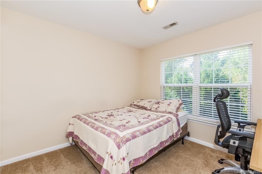 3900 Caliper Place Fort Mill, SC 29708 - Photo 17 of 27 a bedroom with a bed and a window