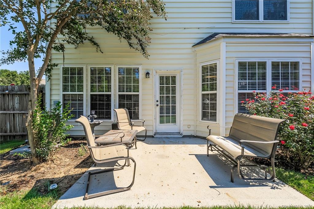 3900 Caliper Place Fort Mill, SC 29708 - Photo 23 of 27 a view of a house with backyard sitting area and porch