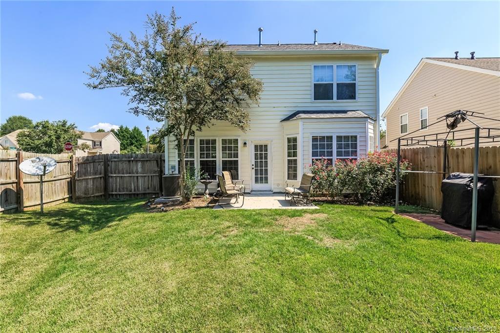 3900 Caliper Place Fort Mill, SC 29708 - Photo 24 of 27 a view of a house with backyard sitting area and garden