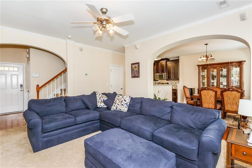 3900 Caliper Place Fort Mill, SC 29708 - Photo 4 of 27 a living room with furniture fireplace and flat screen tv