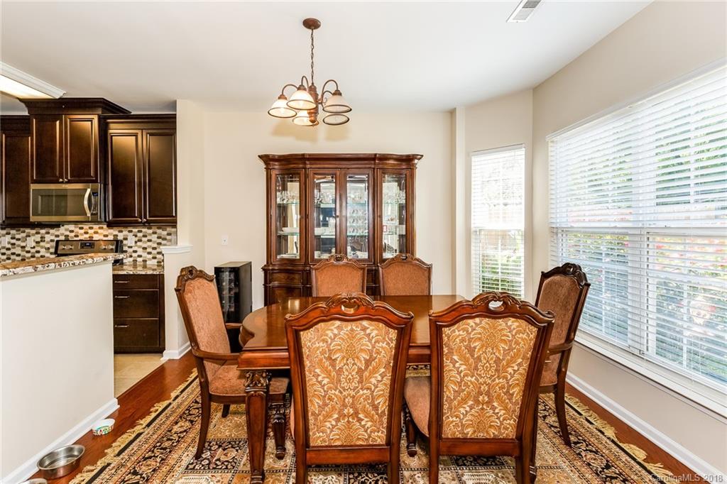 3900 Caliper Place Fort Mill, SC 29708 - Photo 8 of 27 a view of a dining room with furniture window and outside view
