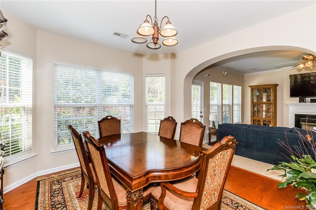 3900 Caliper Place Fort Mill, SC 29708 - Photo 9 of 27 a view of a dining room with furniture window and wooden floor