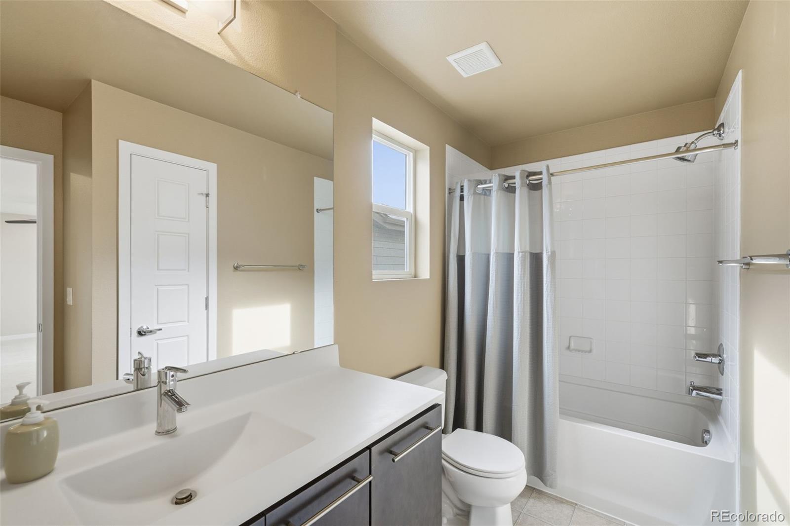 9602 Dunning Circle Highlands Ranch, CO 80126 - Photo 35 of 50 a bathroom with a sink toilet and shower