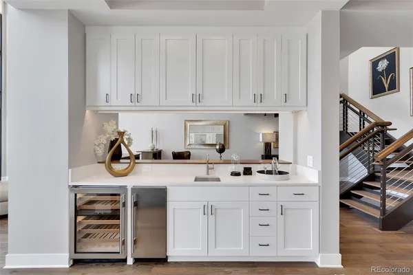 a bathroom with a large tub sink and mirror
