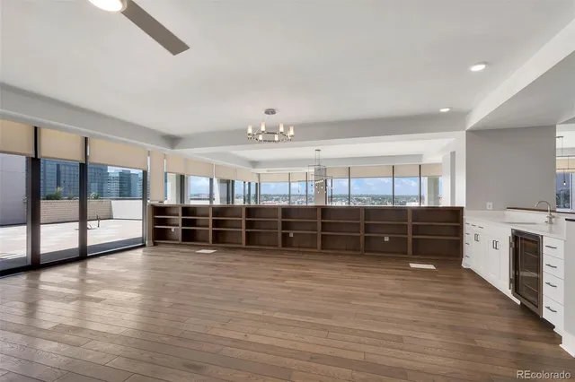 a view of kitchen with furniture and wooden floor