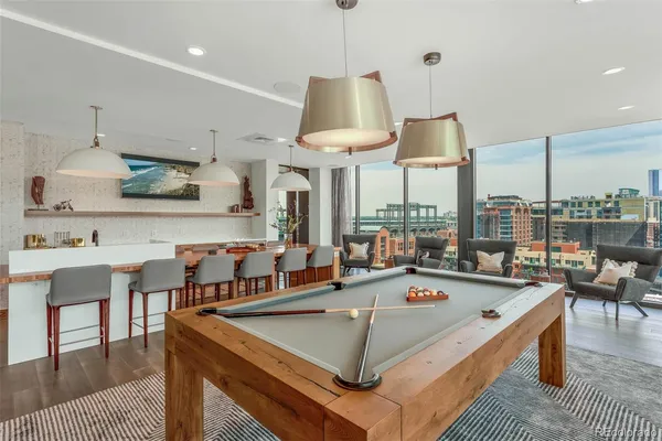 a view of a swimming pool with outdoor seating