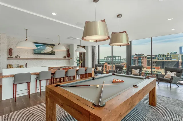 a view of a swimming pool with outdoor seating