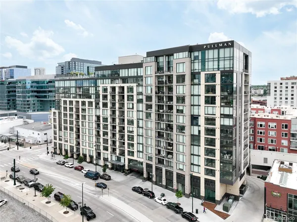 a kitchen with stainless steel appliances a stove a sink and a refrigerator