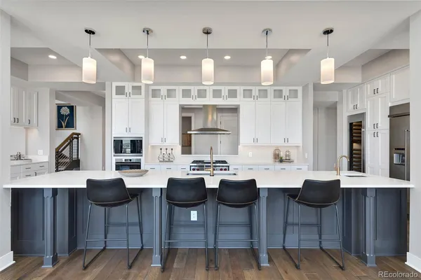 a dining room with furniture and wooden floor