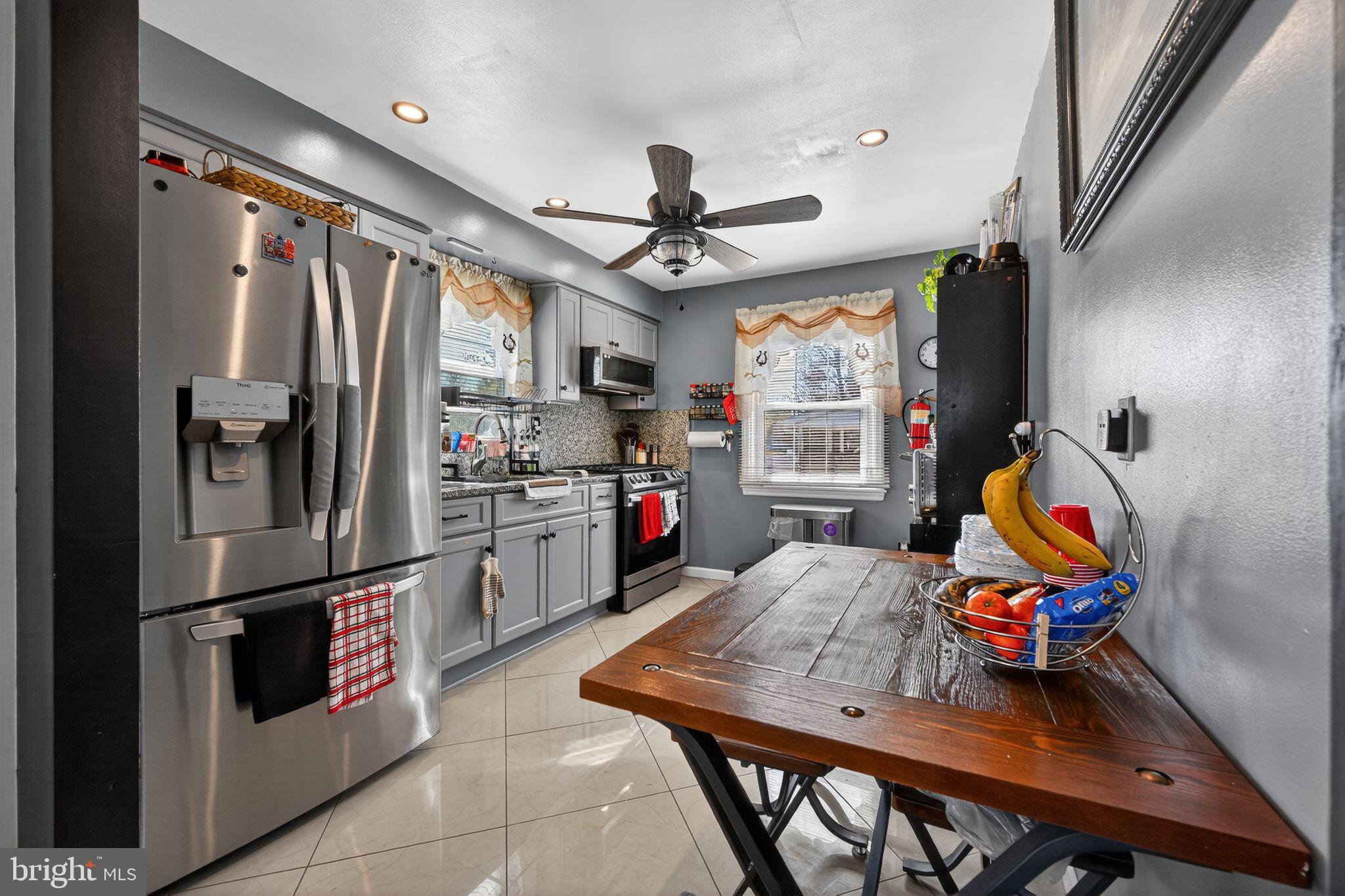 2021 South Brighton Avenue Clementon, NJ 08021 - Photo 4 of 14 a kitchen with stainless steel appliances granite countertop a refrigerator and a sink
