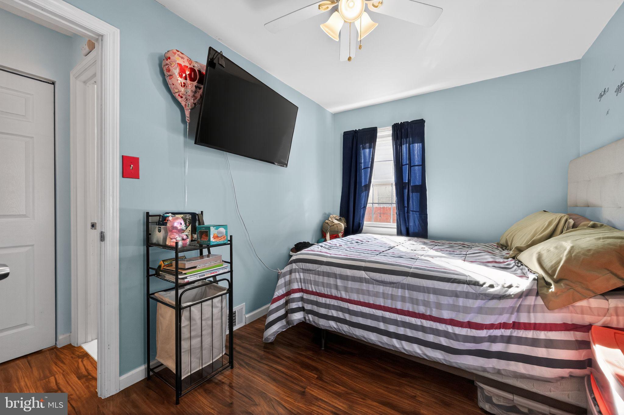 2021 South Brighton Avenue Clementon, NJ 08021 - Photo 5 of 14 a bedroom with a bed and a flat screen tv