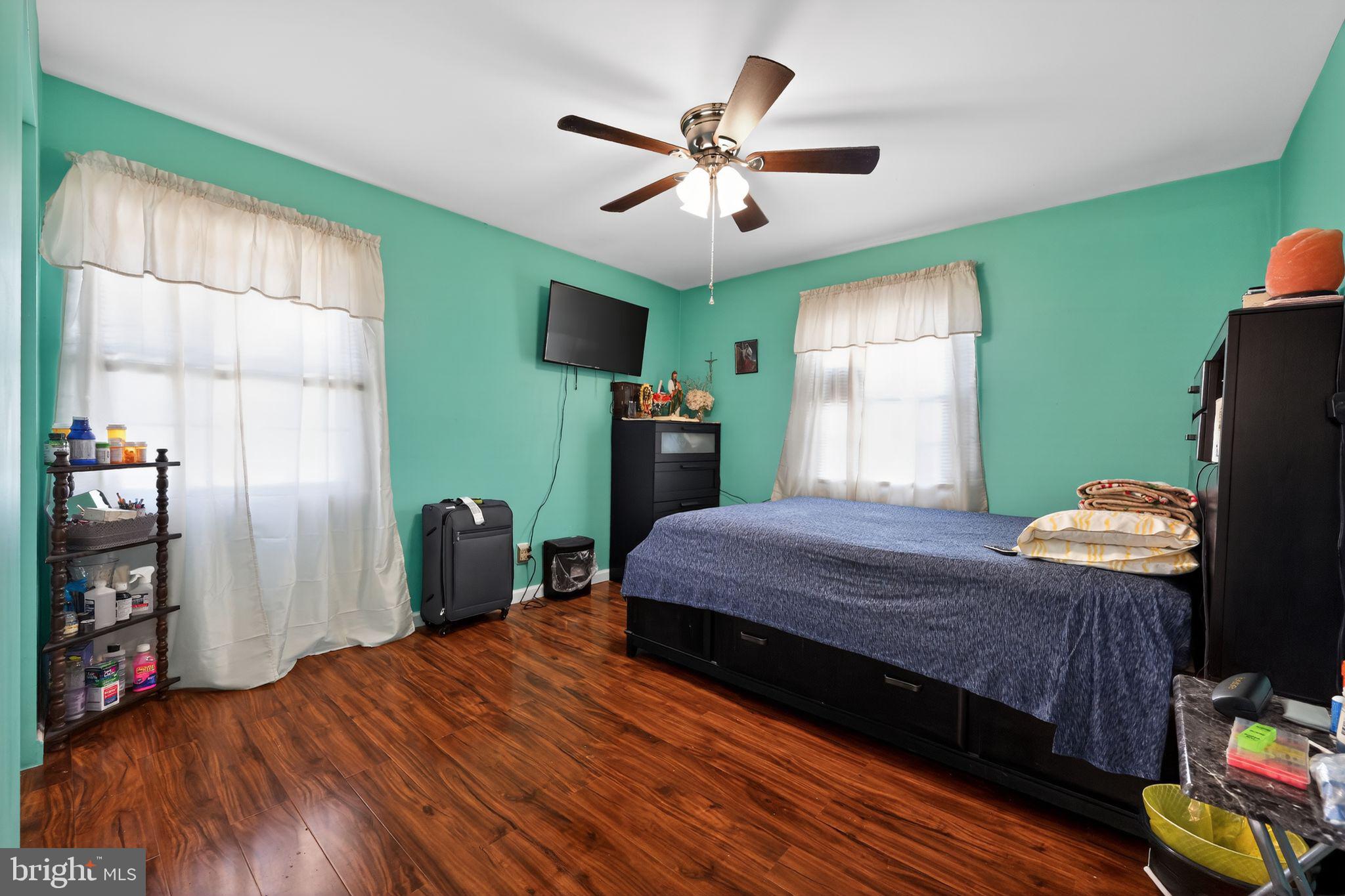 2021 South Brighton Avenue Clementon, NJ 08021 - Photo 6 of 14 a bedroom with a bed and a chandelier