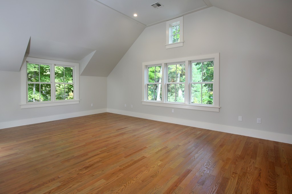 135 Neshobe Road Newton, MA 02468 - Photo 11 of 15 an empty room with wooden floor and windows